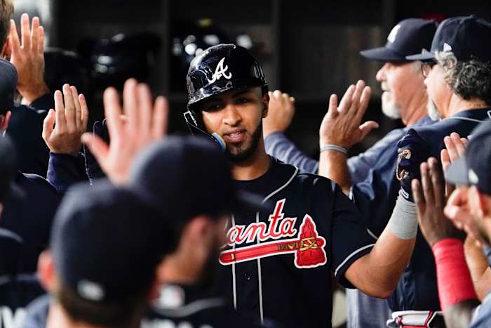 May 17, 2023; Arlington, Texas, USA; Atlanta Braves left fielder Eddie Rosario (8) is greet in the dugout after hitting a two-run home run during the second inning against the Texas Rangers at Globe Life Field. Mandatory Credit: Raymond Carlin III-USA TODAY Sports